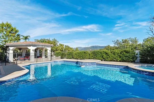 a view of a swimming pool with an outdoor seating