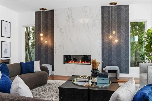 a living room with furniture and a lamp
