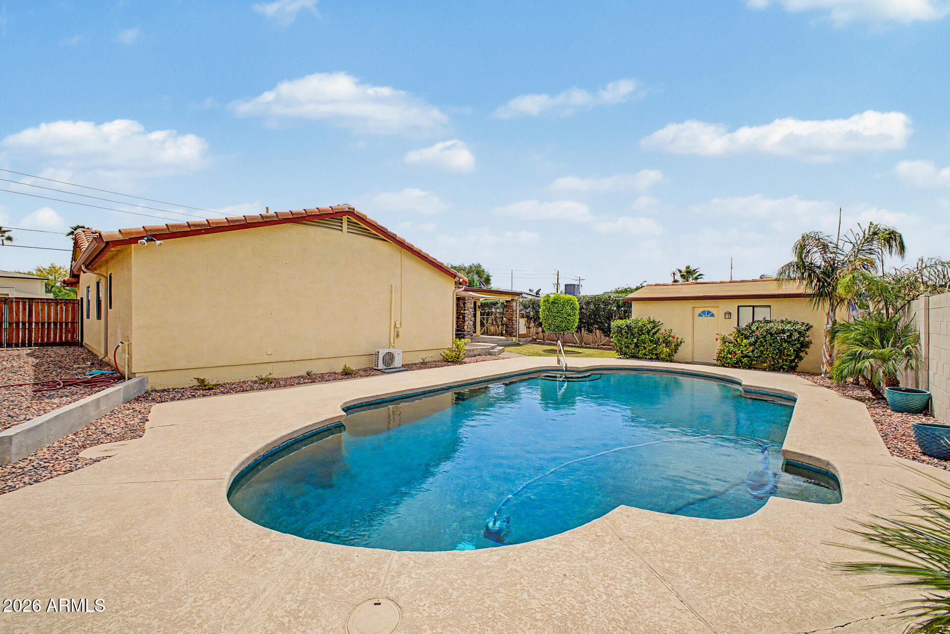 802 East Roberts Road Phoenix, AZ 85022 - Photo 21 of 24 a view of a swimming pool with a yard