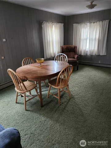 a view of a livingroom with furniture and window