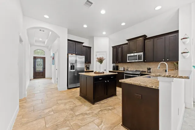 a large kitchen with cabinets