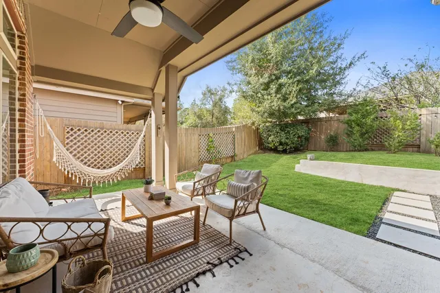 a view of a patio with a yard