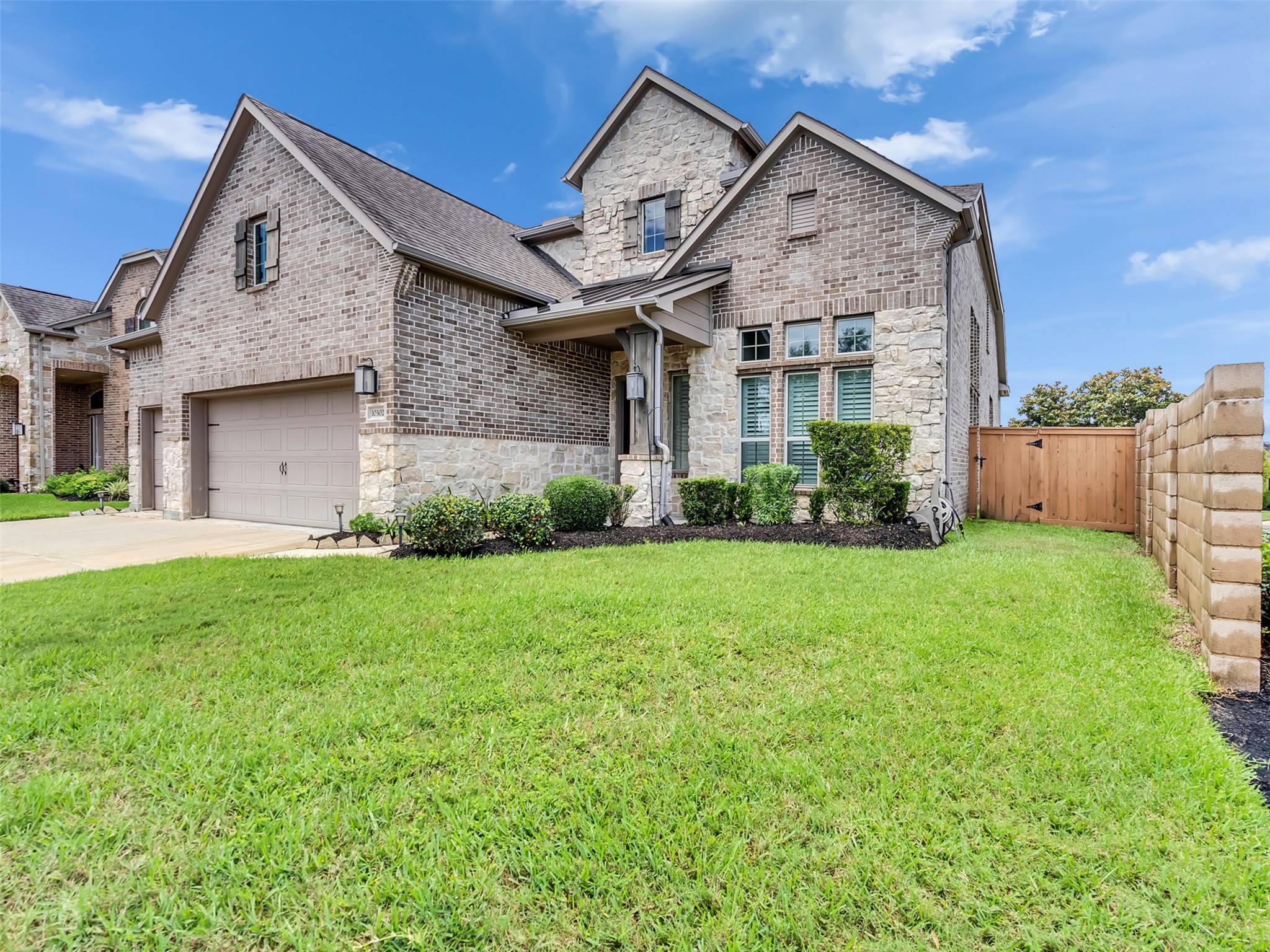 10302 Muir Peak Drive Rosharon, TX 77583 - Photo 2 of 40 Side view showing detailed stone and brick work