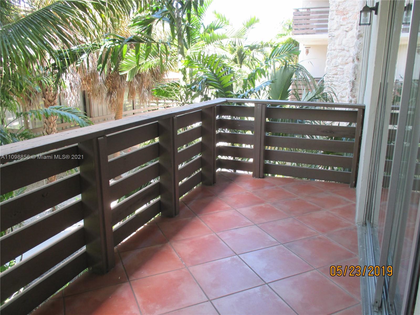 7483 Southwest 82nd Street, Unit A207 Miami, FL 33143 - Photo 15 of 27 a view of a back yard from a balcony