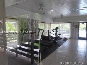 7483 Southwest 82nd Street, Unit A207 Miami, FL 33143 - Photo 16 of 27 a view of a porch with a potted plant