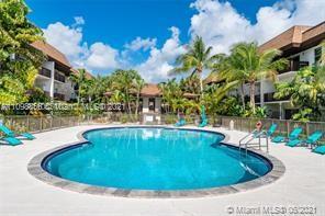 7483 Southwest 82nd Street, Unit A207 Miami, FL 33143 - Photo 21 of 27 a view of a swimming pool with a yard