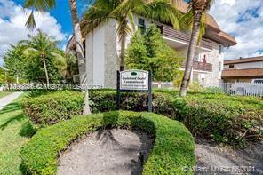 7483 Southwest 82nd Street, Unit A207 Miami, FL 33143 - Photo 24 of 27 a view of a garden with a building