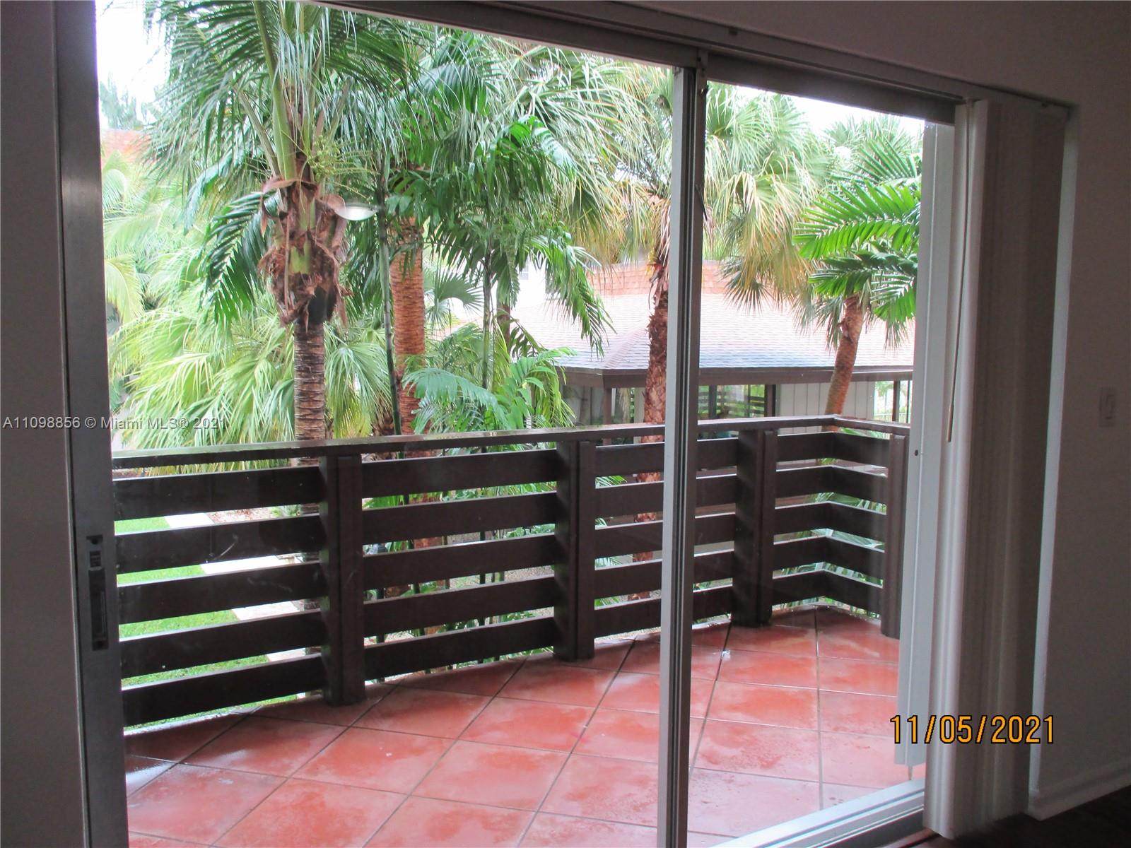 7483 Southwest 82nd Street, Unit A207 Miami, FL 33143 - Photo 26 of 27 a view of a bench in a yard
