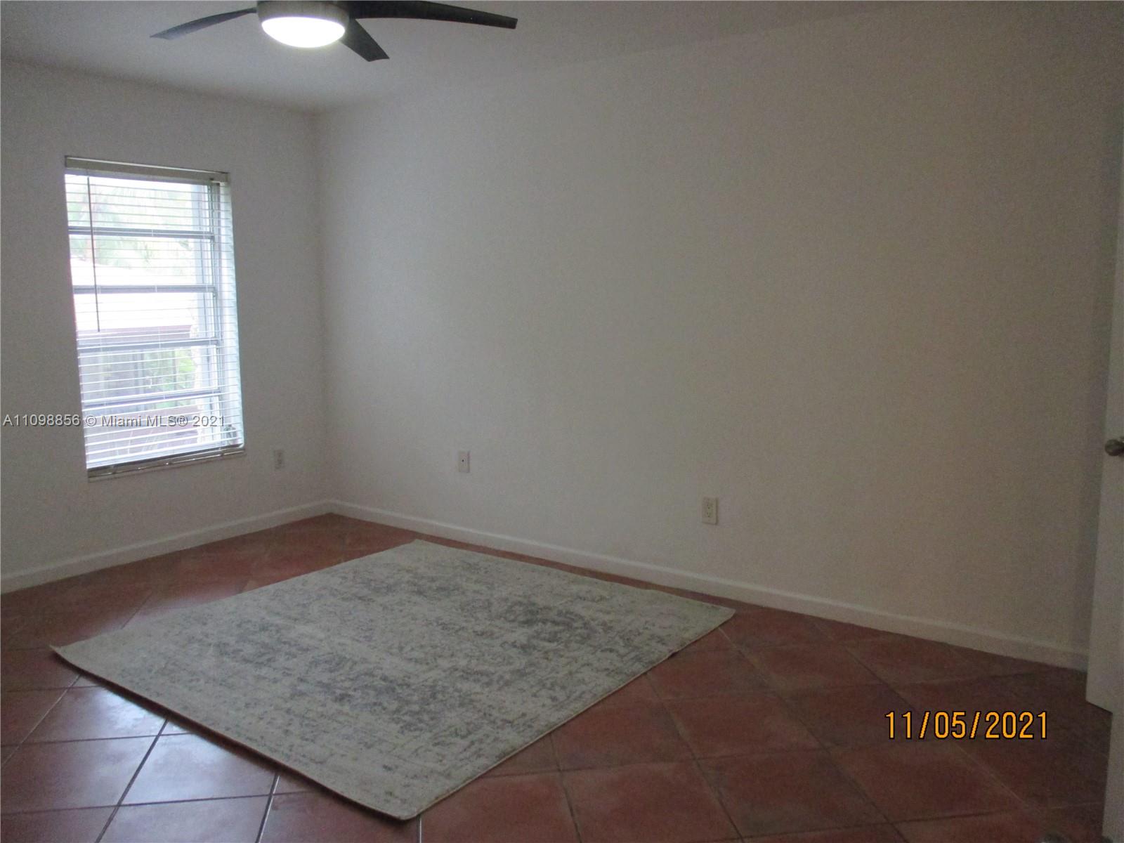 7483 Southwest 82nd Street, Unit A207 Miami, FL 33143 - Photo 27 of 27 an empty room with a window