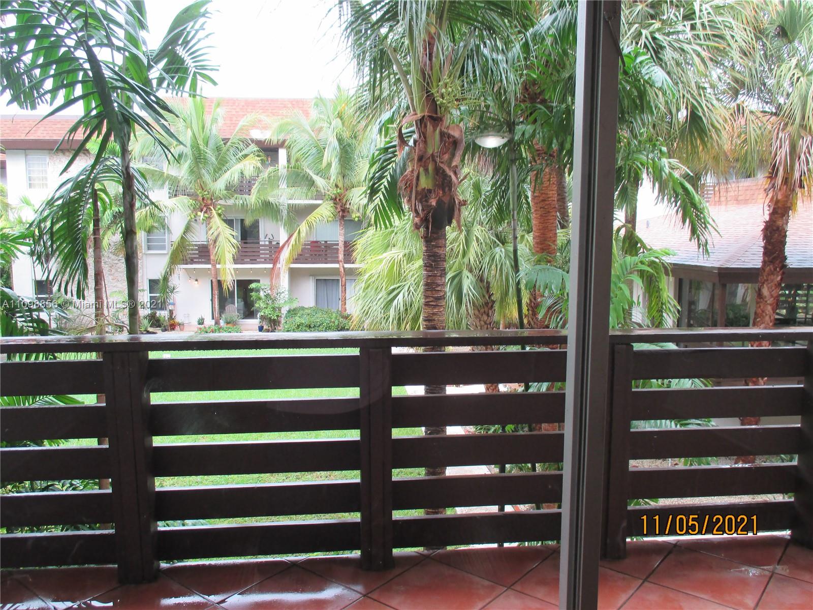 7483 Southwest 82nd Street, Unit A207 Miami, FL 33143 - Photo 7 of 27 a view of a street with tree s