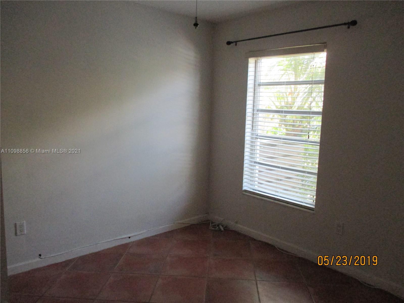7483 Southwest 82nd Street, Unit A207 Miami, FL 33143 - Photo 10 of 27 a view of an empty room and a window