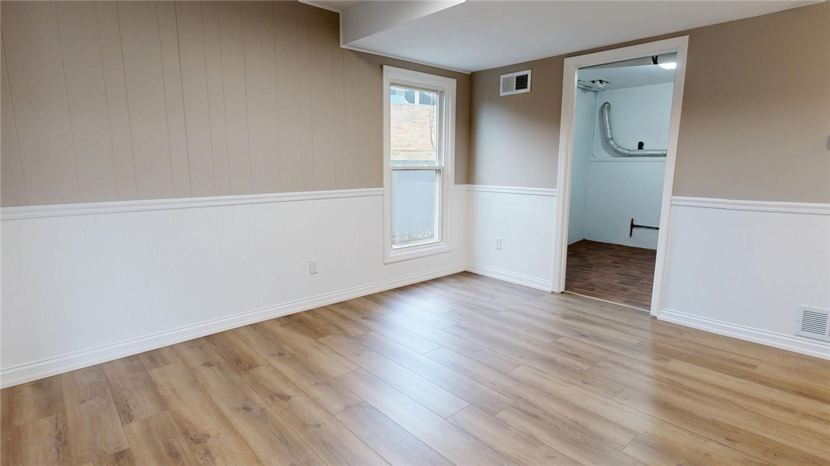 4153 Buckingham Drive Decatur, IL 62526 - Photo 9 of 34 a view of an empty room with wooden floor and closet