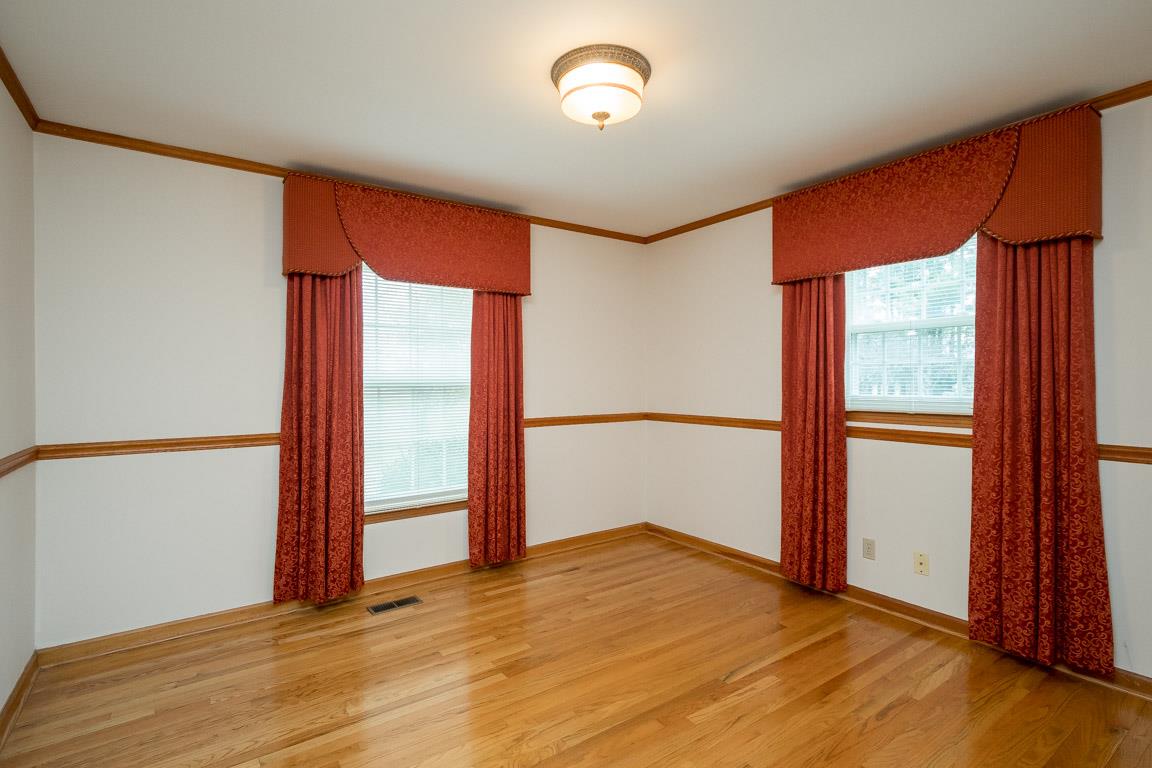 4125 Cross Plains Road Springfield, TN 37172 - Photo 22 of 30 an empty room with wooden floor and windows