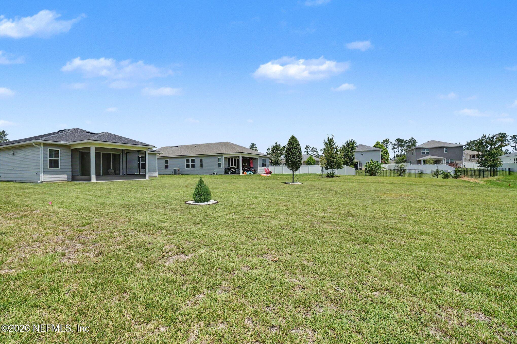 4630 Pine Ridge Parkway Middleburg, FL 32068 - Photo 30 of 35 a view of a house with a yard and sitting area