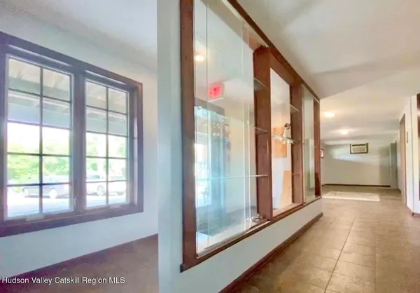 a bathroom with a sink mirror and shower