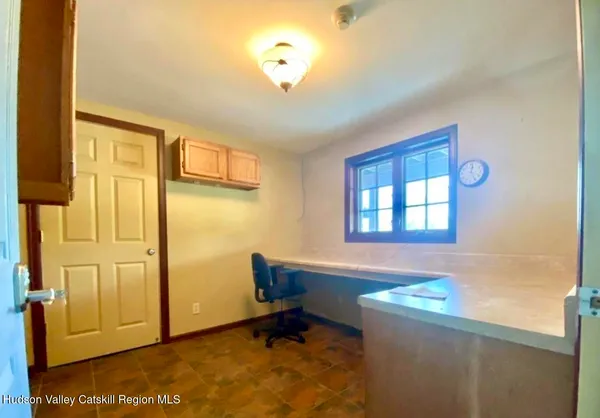 a large kitchen with stainless steel appliances kitchen island granite countertop a sink and cabinets
