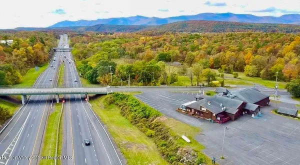 a view of a swimming pool with a table and chairs
