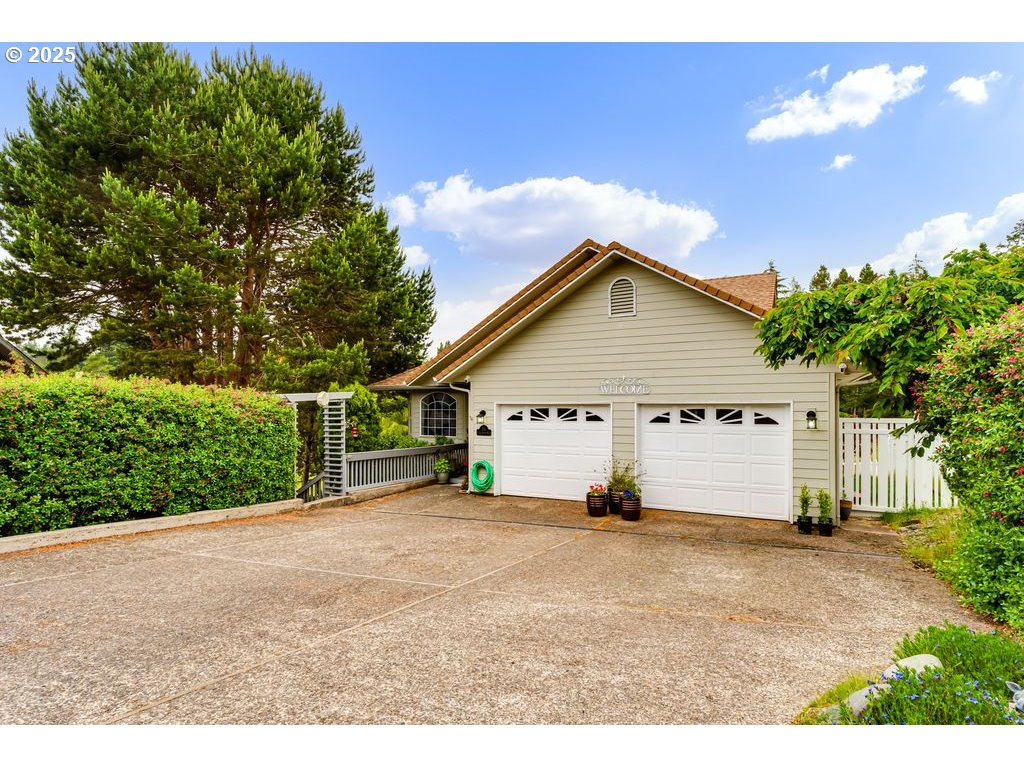 a view of a house with wooden fence