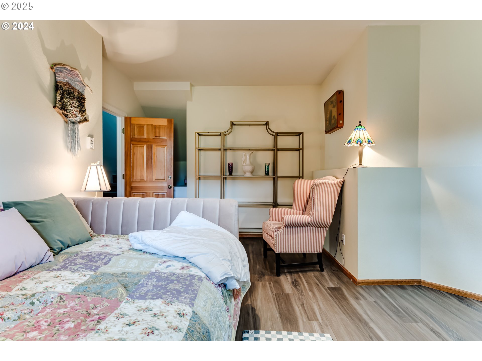 36 Ocean Dunes Drive Florence, OR 97439 - Photo 27 of 40 a bedroom with a bed and wooden floor