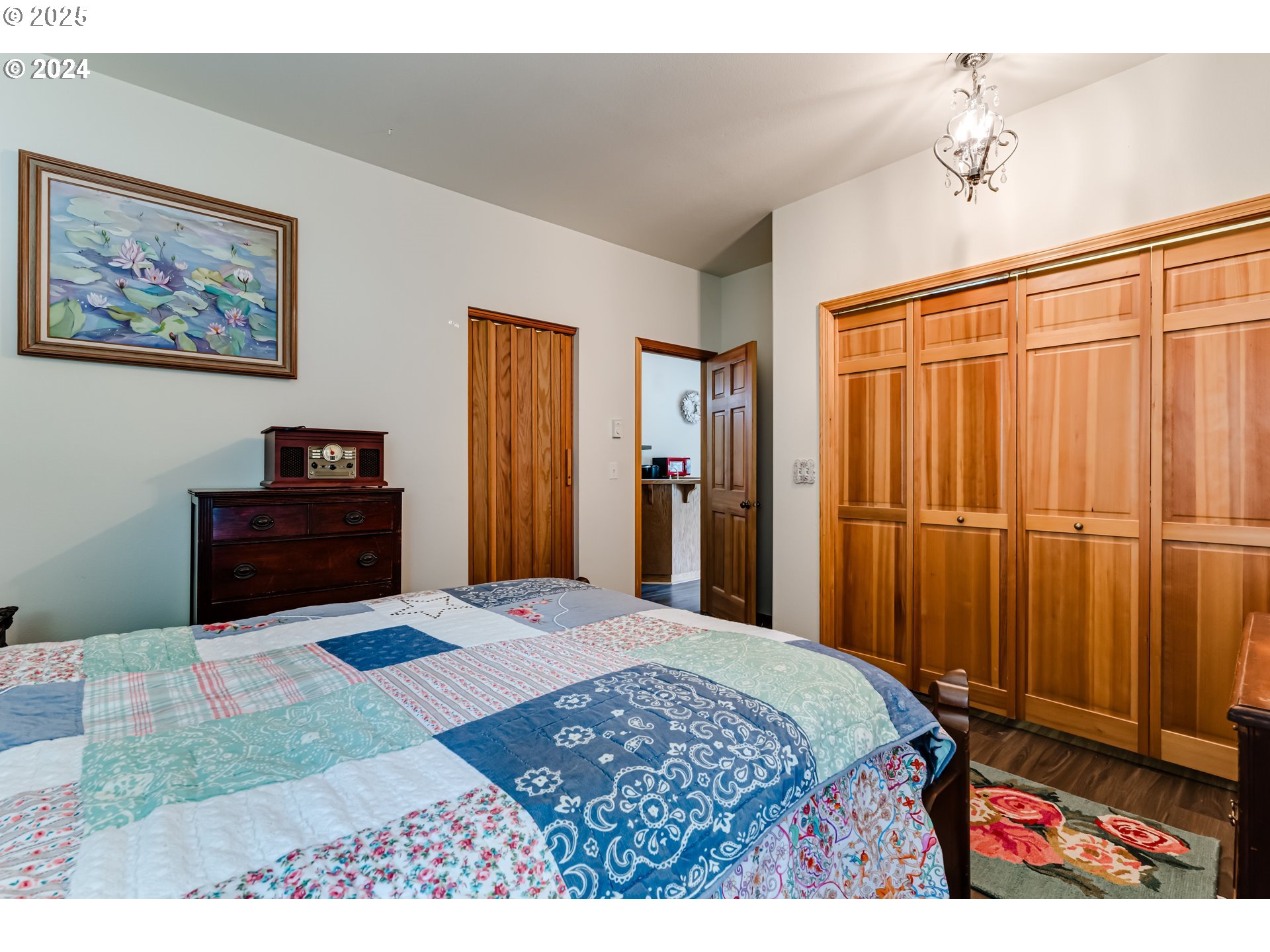 36 Ocean Dunes Drive Florence, OR 97439 - Photo 34 of 40 a bedroom with a bed and a dresser