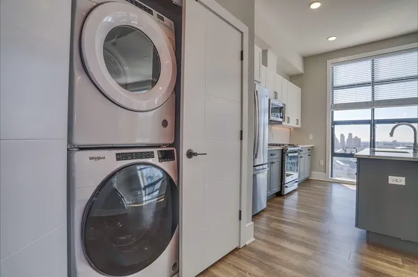 a view of a kitchen with washer and dryer