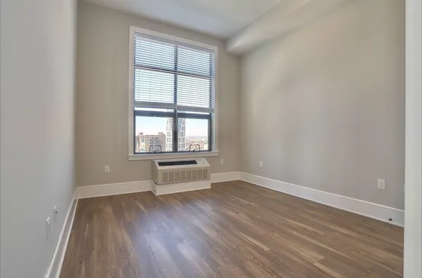 wooden floor and window in an empty room
