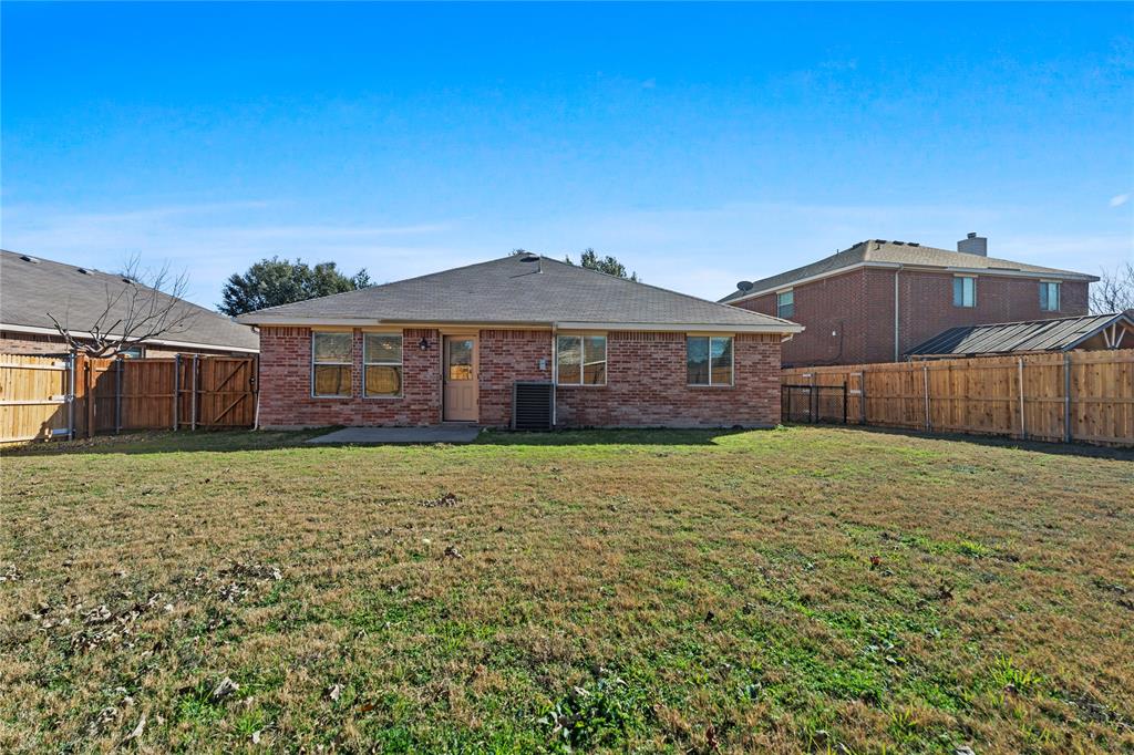 3256 Torio Grand Prairie, TX 75054 - Photo 14 of 17 a front view of a house with a yard