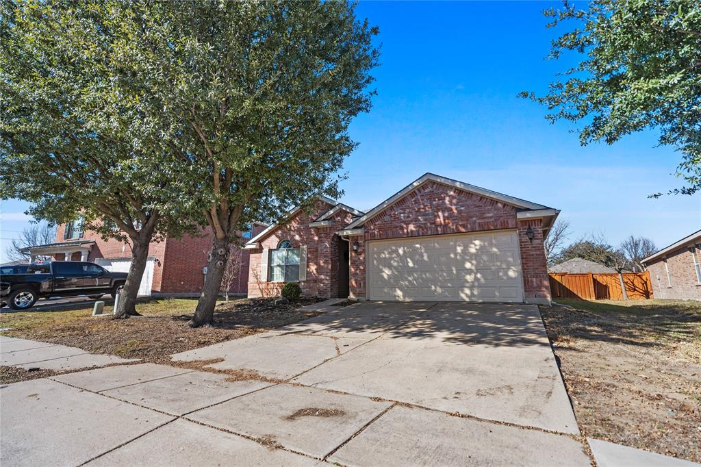 3256 Torio Grand Prairie, TX 75054 - Photo 2 of 17 a front view of a house with a yard