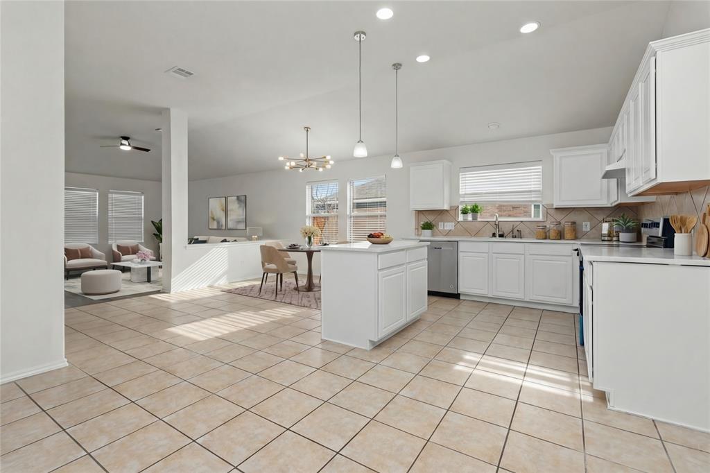 3256 Torio Grand Prairie, TX 75054 - Photo 17 of 17 a large white kitchen with a lot of cabinets and a wooden floor