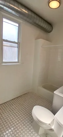 a bathroom with a toilet