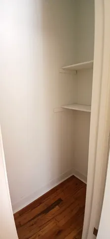 a view of small space with wooden floor