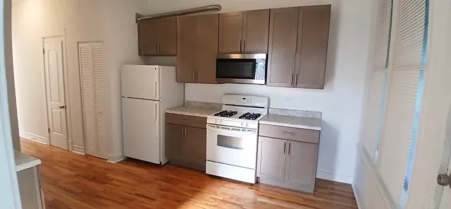 a kitchen with a stove microwave and refrigerator