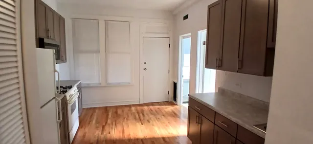 a view of a kitchen from the hallway