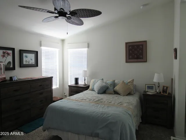 a bedroom with a bed and a dresser