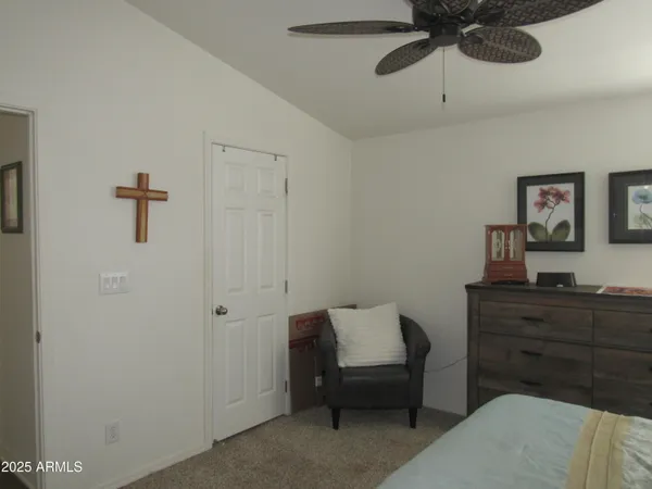 a bedroom with a bed and a dresser