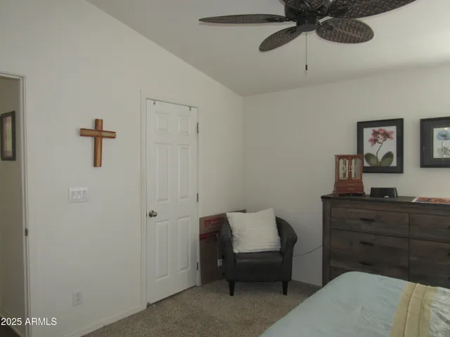 a bedroom with a bed and a dresser