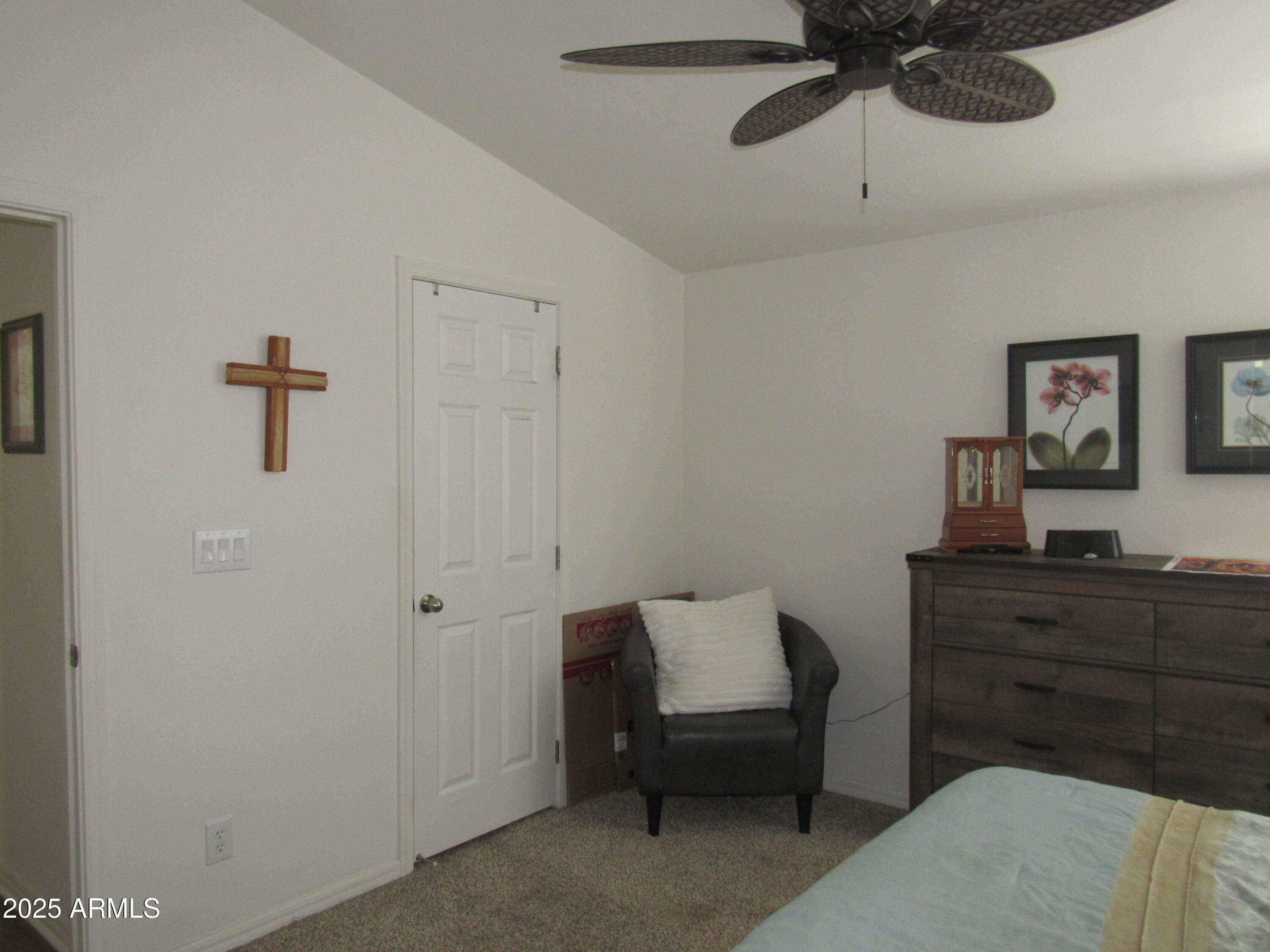 7570 East Speedway Boulevard, Unit 573 Tucson, AZ 85710 - Photo 13 of 16 a bedroom with a bed and a dresser