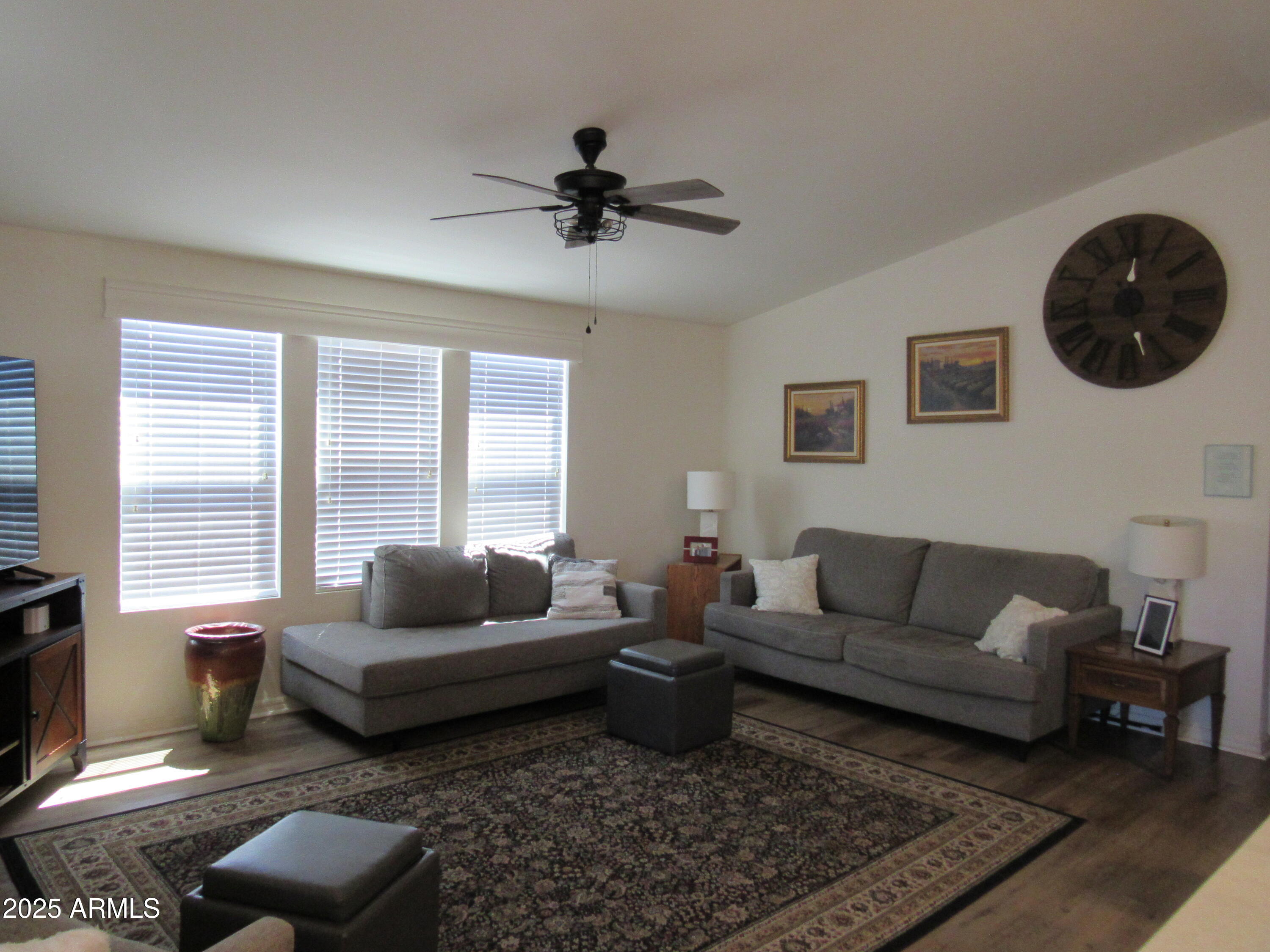 7570 East Speedway Boulevard, Unit 573 Tucson, AZ 85710 - Photo 3 of 16 a living room with furniture and a window