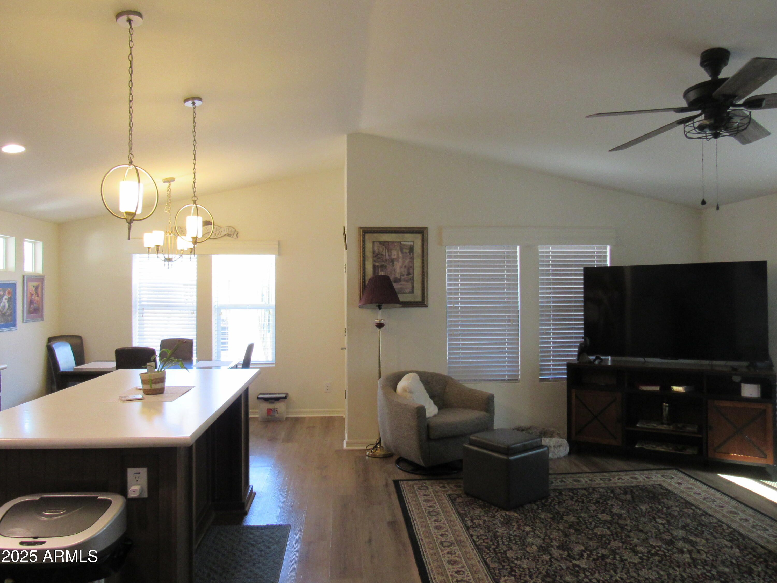 7570 East Speedway Boulevard, Unit 573 Tucson, AZ 85710 - Photo 4 of 16 a living room with furniture and a flat screen tv