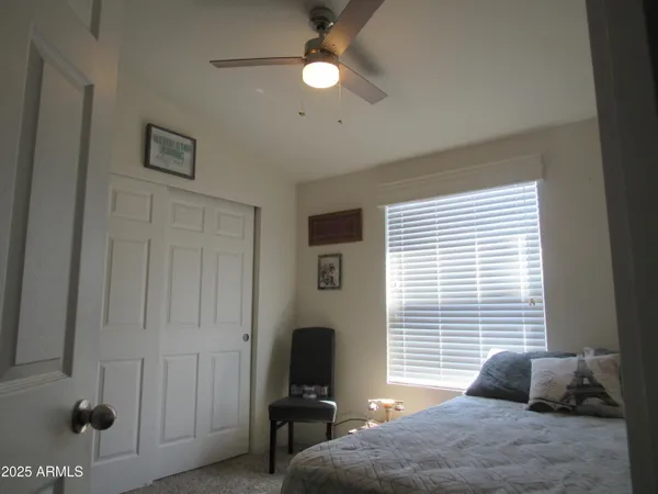 a bedroom with furniture and a window