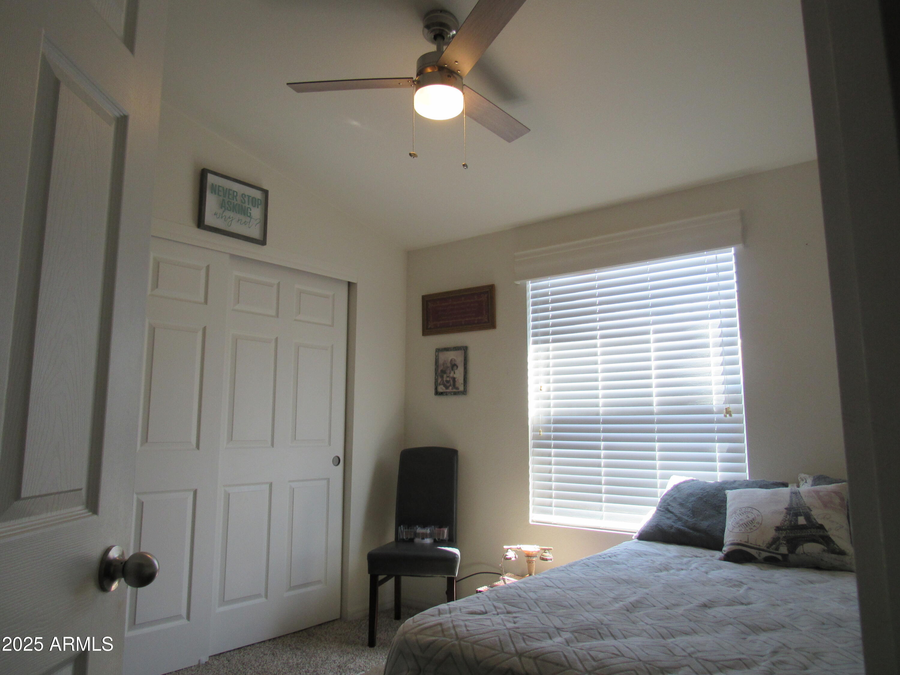 7570 East Speedway Boulevard, Unit 573 Tucson, AZ 85710 - Photo 10 of 16 a bedroom with furniture and a window