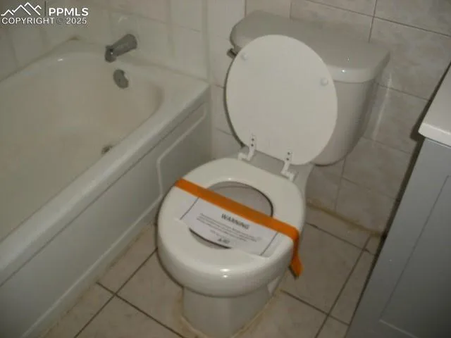 a bathroom with a toilet and a sink
