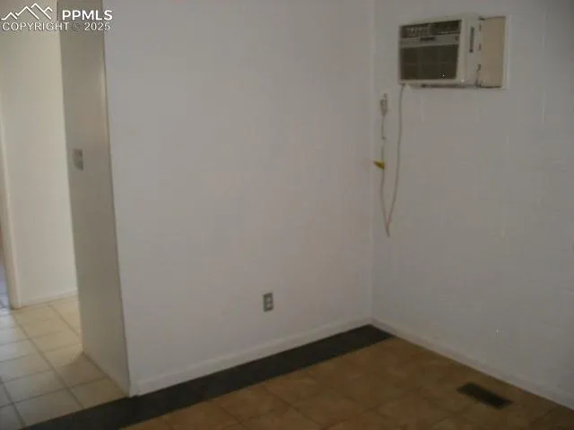 a view of an empty room and window