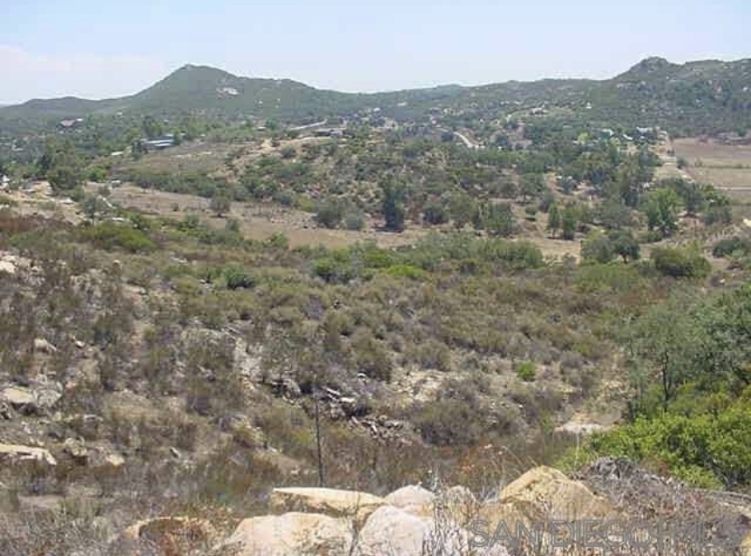 6317 Japatul Highlands Road Alpine, CA 91901 - Photo 6 of 15 a view of a mountain in the distance in a field