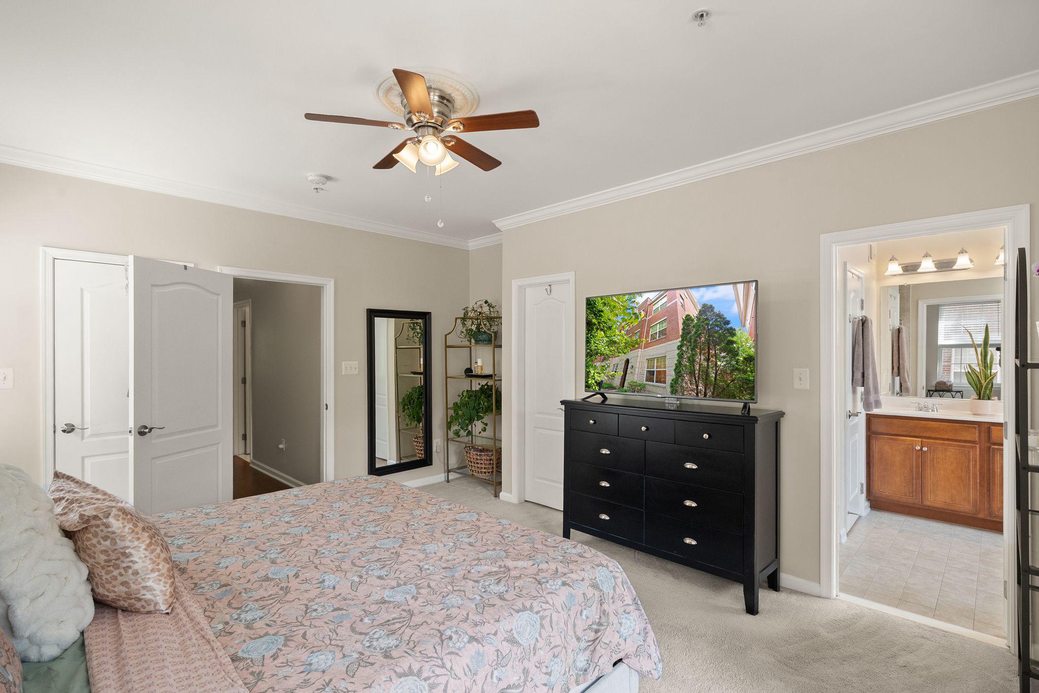 12414 A Liberty Bridge Road Fairfax, VA 22033 - Photo 18 of 38 a bedroom with a bed and a dresser