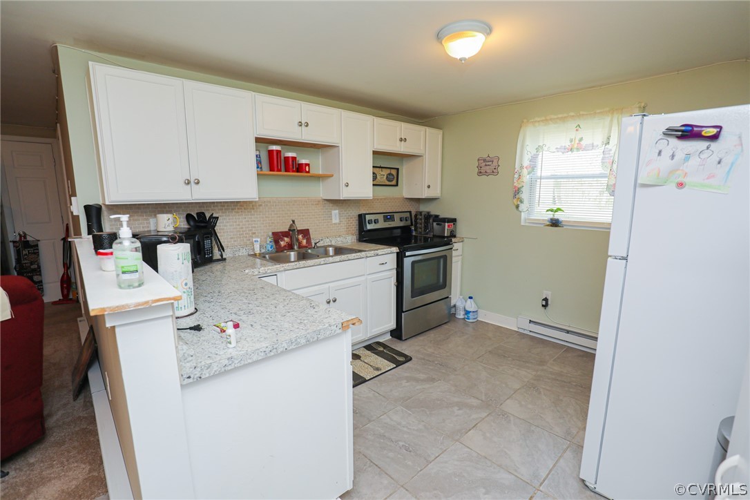 5346 Cold Harbor Road Mechanicsville, VA 23111 - Photo 32 of 42 Basement Kitchen with flat top range and refrigera