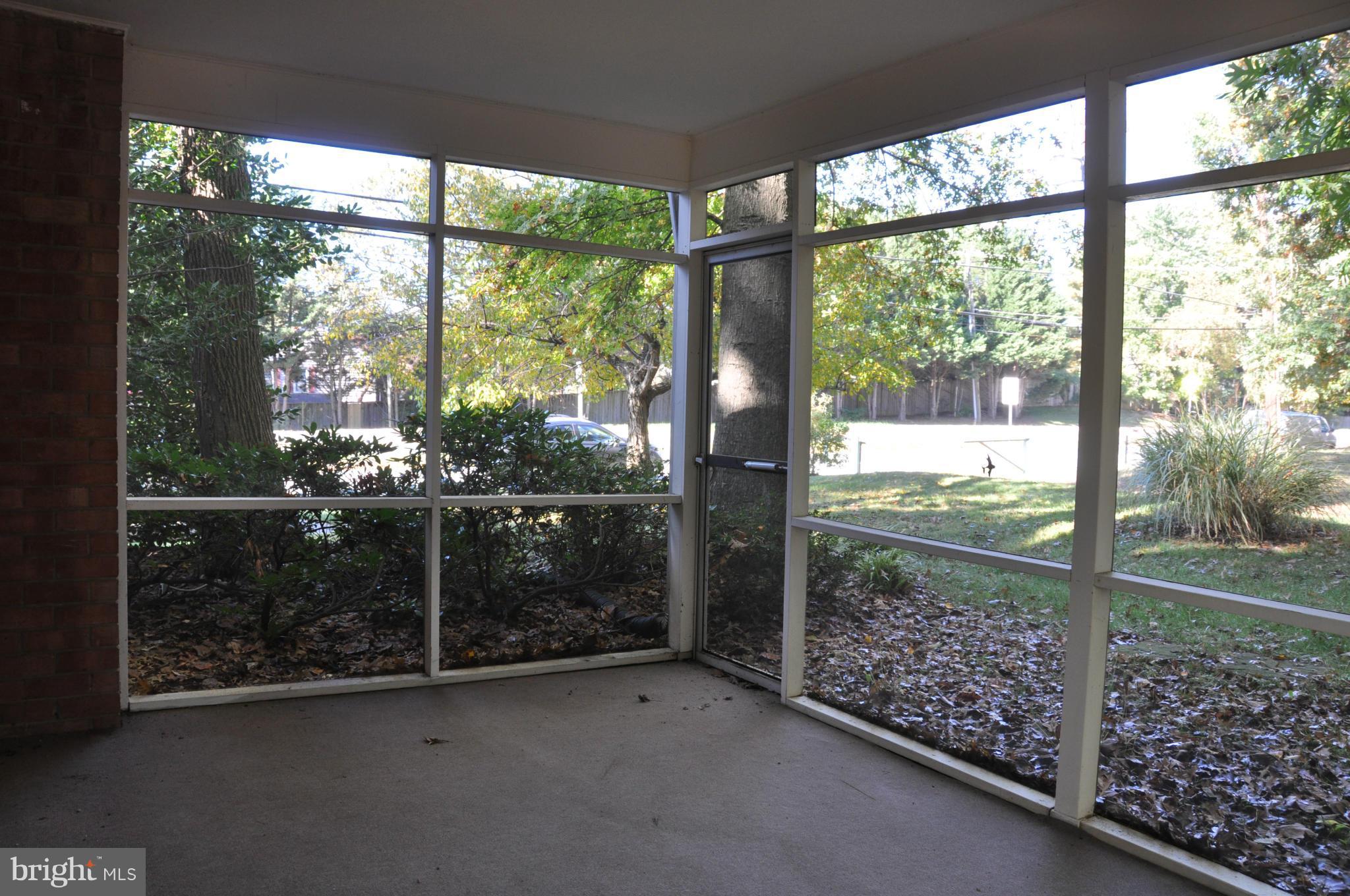 5417 Rolling Road Springfield, VA 22151 - Photo 17 of 20 a view of a glass door with a yard from balcony