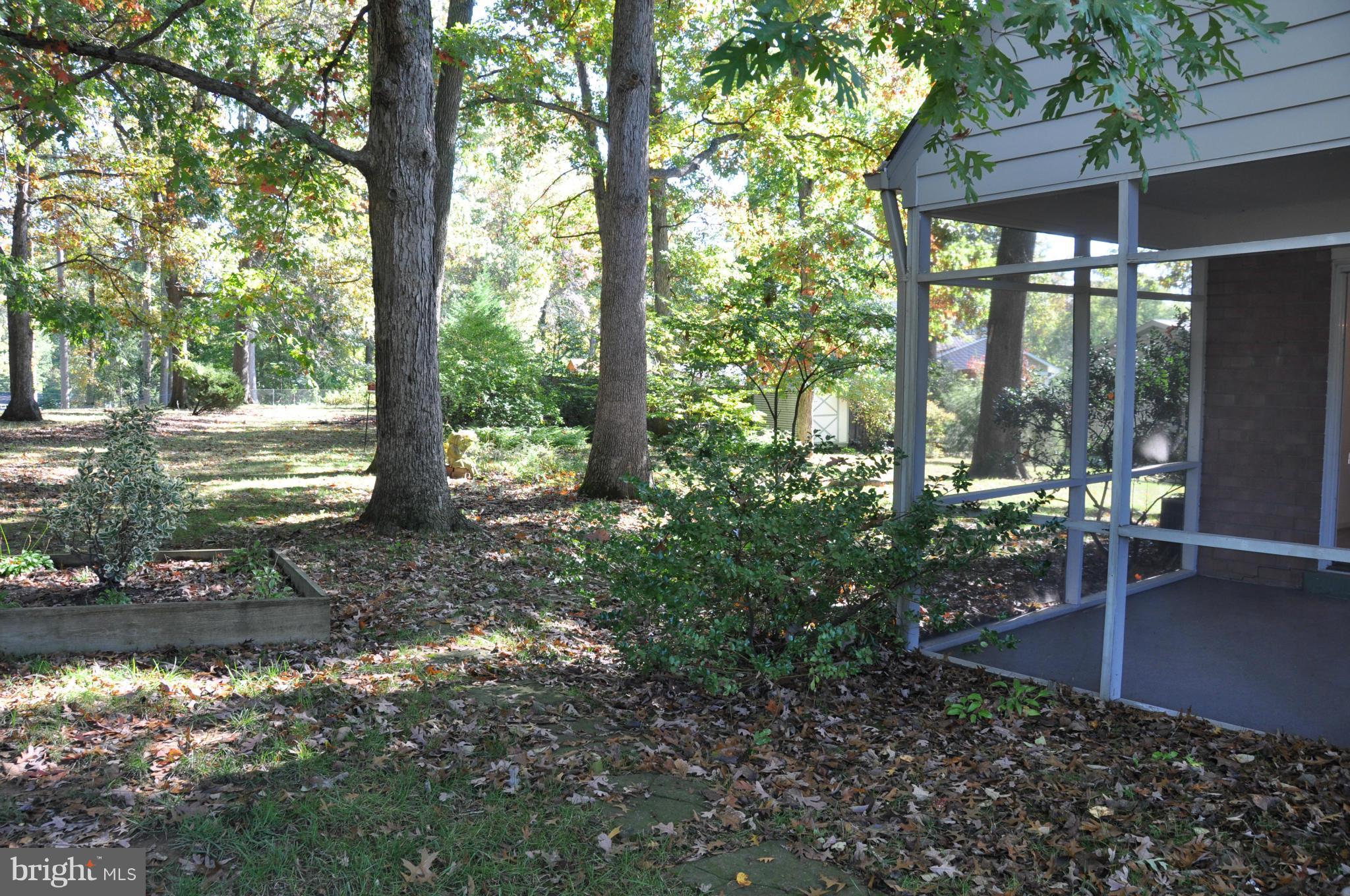5417 Rolling Road Springfield, VA 22151 - Photo 19 of 20 a backyard of a house with table and chairs