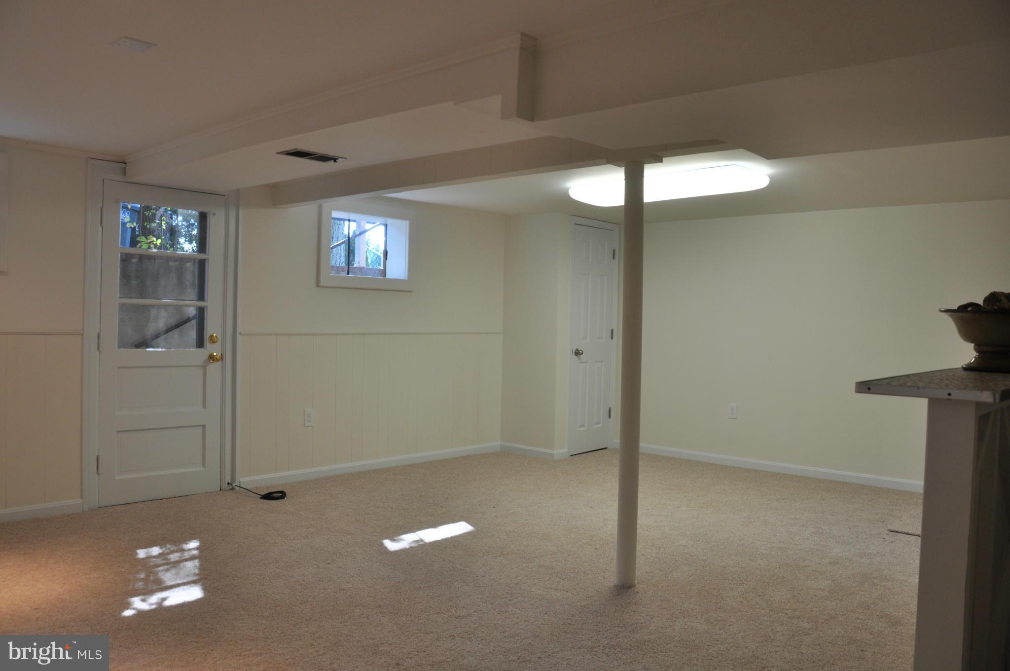 5417 Rolling Road Springfield, VA 22151 - Photo 6 of 20 a view of a room with a projector