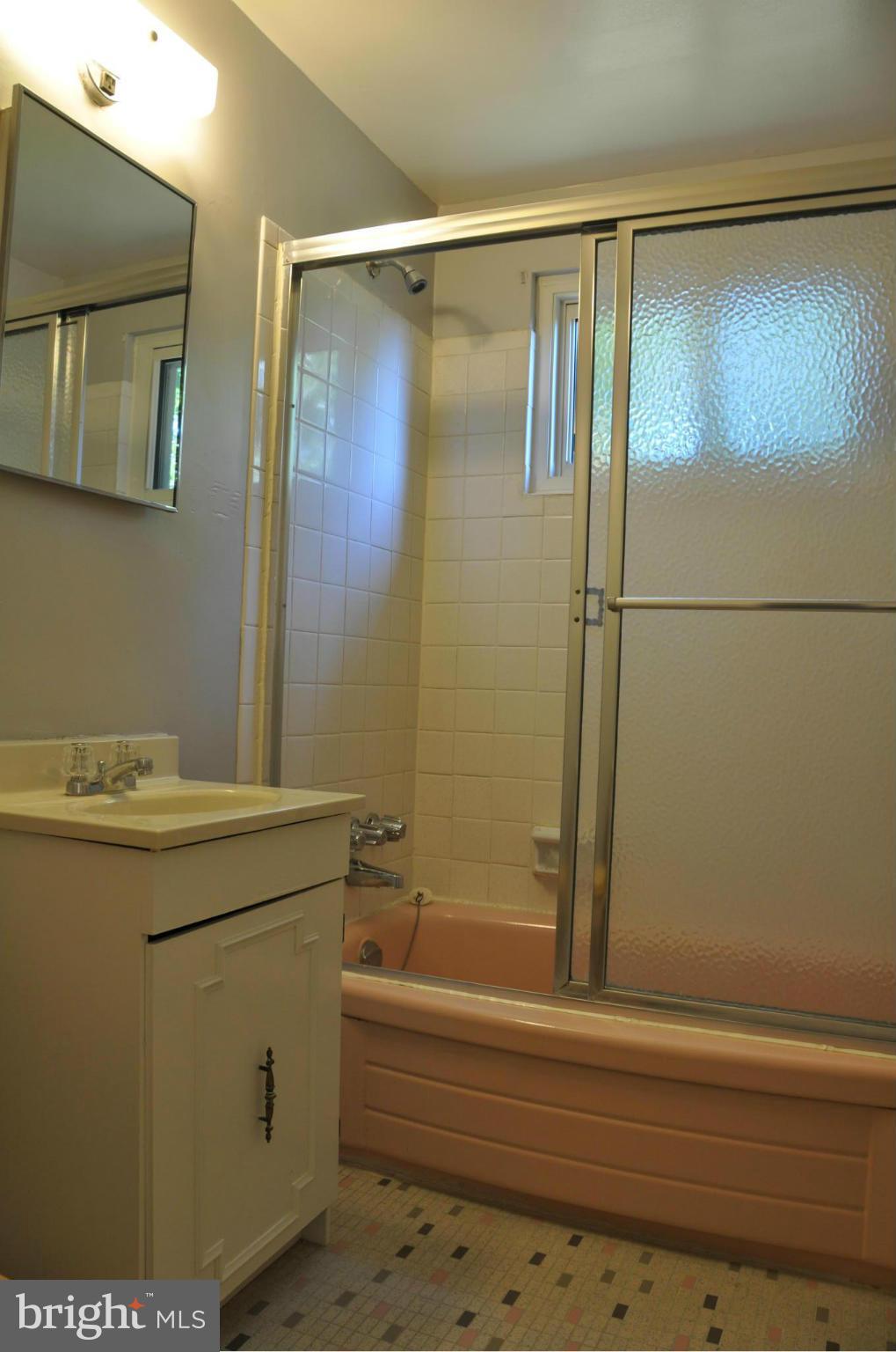 5417 Rolling Road Springfield, VA 22151 - Photo 9 of 20 a bathroom with a shower and a sink